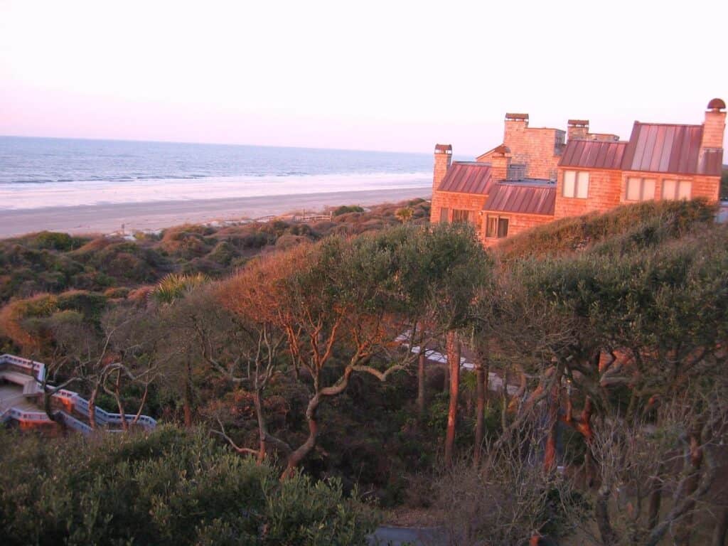 Image of oceanfront vacation rentals at sunset