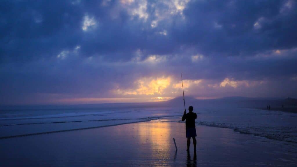 Man fishing on Kiawah Island during his South Carolina vacation