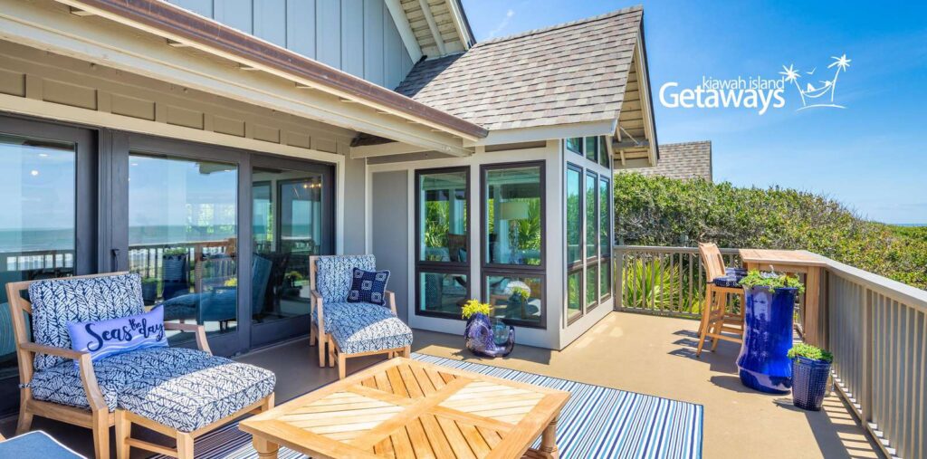 Spacious oceanfront deck at Ocean Blue Villa, managed by Kiawah Island Property Management, with comfortable outdoor furniture.