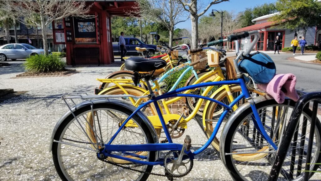 A lineup of rental bikes awaits adventurers in Kiawah Island, a preferred transportation method featured in the Visit Kiawah Island Guide.