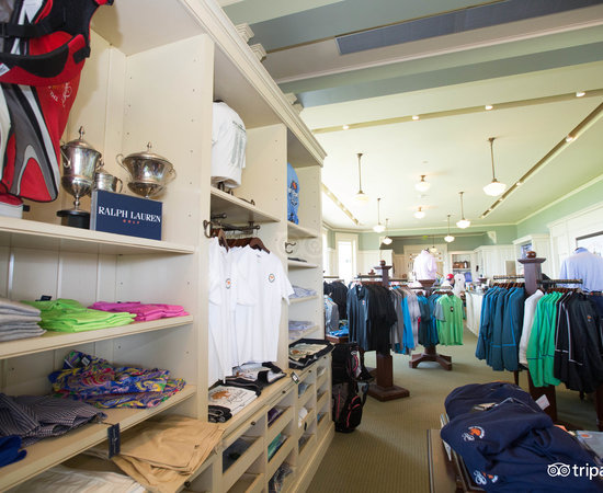 Interior of The Shops at The Sanctuary on Kiawah Island featuring a selection of high-end apparel.